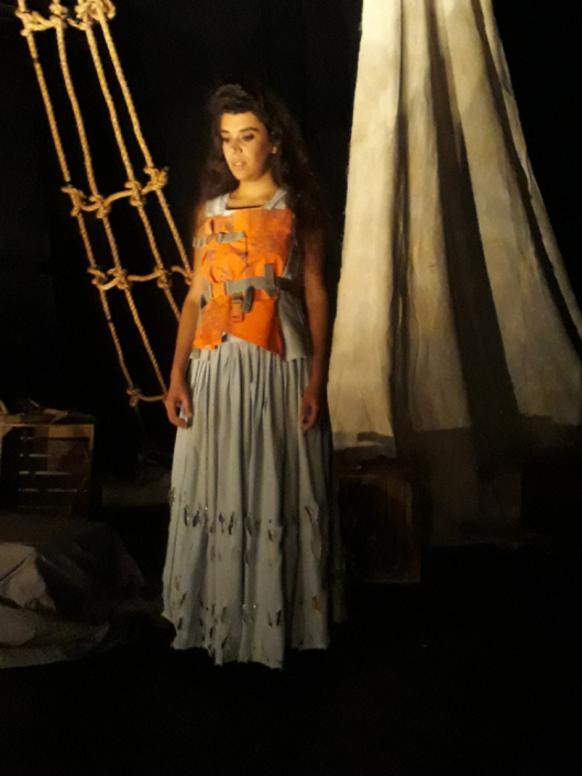 Miranda. Blue cotton bodice & skirt. Bodice of orange Life Jacket. Deep hem covered in safety Pins