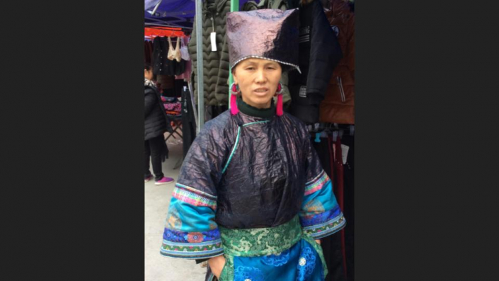 Dong woman wearing jacket & hat of beaten, ‘Shiny’ indigo