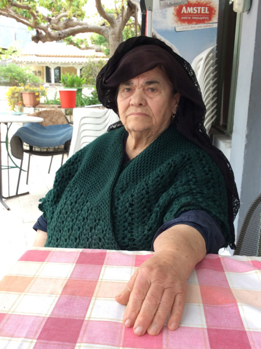 Arsinoi wears typical Lefkadian wear of headscarf. Traditional shawl.