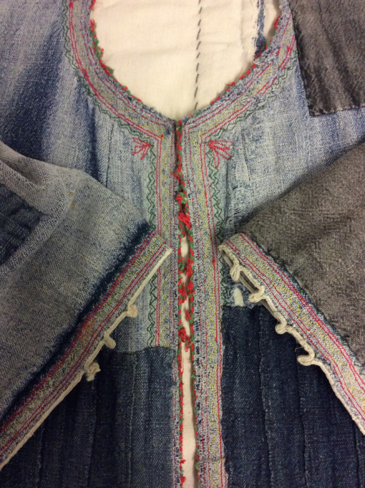 Typical traditional Indigo dyed coat with embroidery. Typically, heavily patched.
