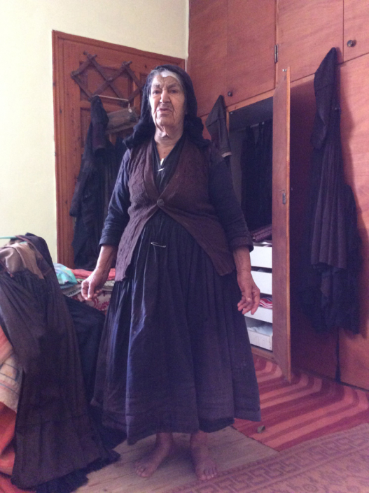 Andrigoni in traditional & heavily patched skirt